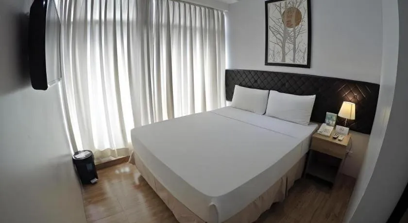 Bed in Capitol Central Hotel and Suites