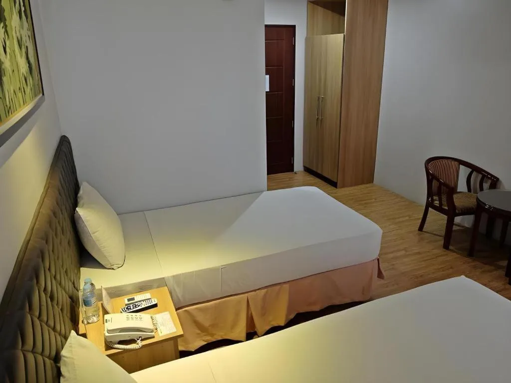 Bed in Capitol Central Hotel and Suites