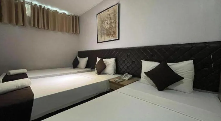 Bed in Capitol Central Hotel and Suites