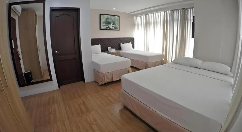 Bed in Capitol Central Hotel and Suites