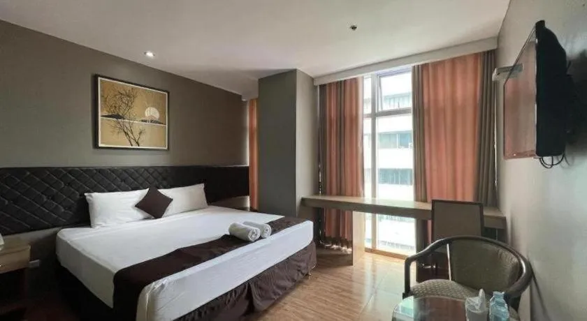 Bed in Capitol Central Hotel and Suites