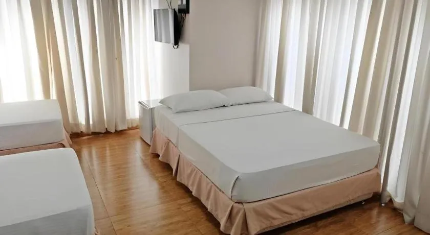 Bed in Capitol Central Hotel and Suites