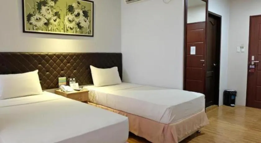 Bed in Capitol Central Hotel and Suites