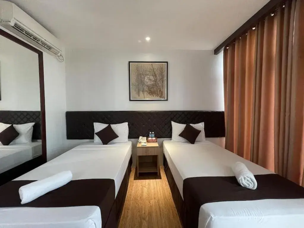 Bed in Capitol Central Hotel and Suites Bed in Capitol Central Hotel and Suites