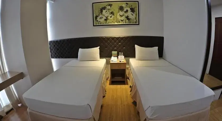 Bed in Capitol Central Hotel and Suites Bed in Capitol Central Hotel and Suites