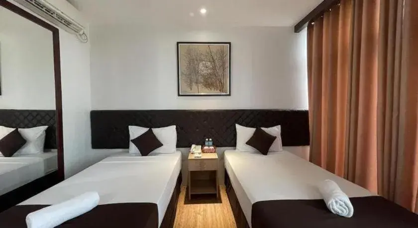 Bed in Capitol Central Hotel and Suites Bed in Capitol Central Hotel and Suites