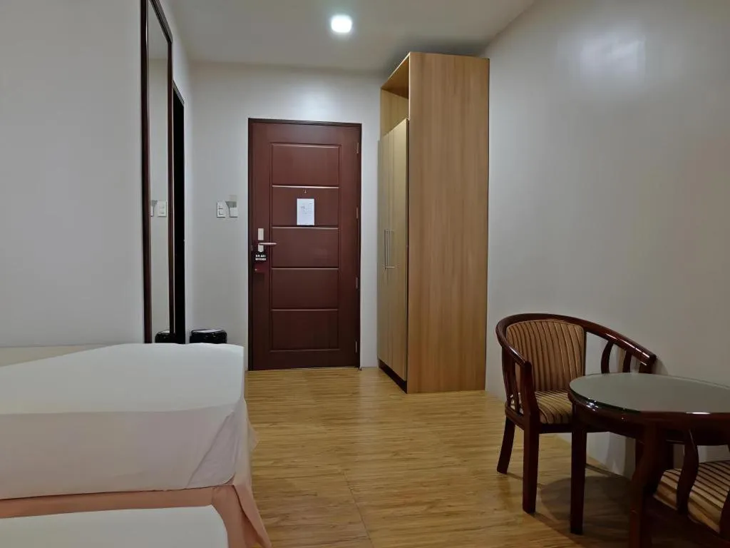 Bed in Capitol Central Hotel and Suites