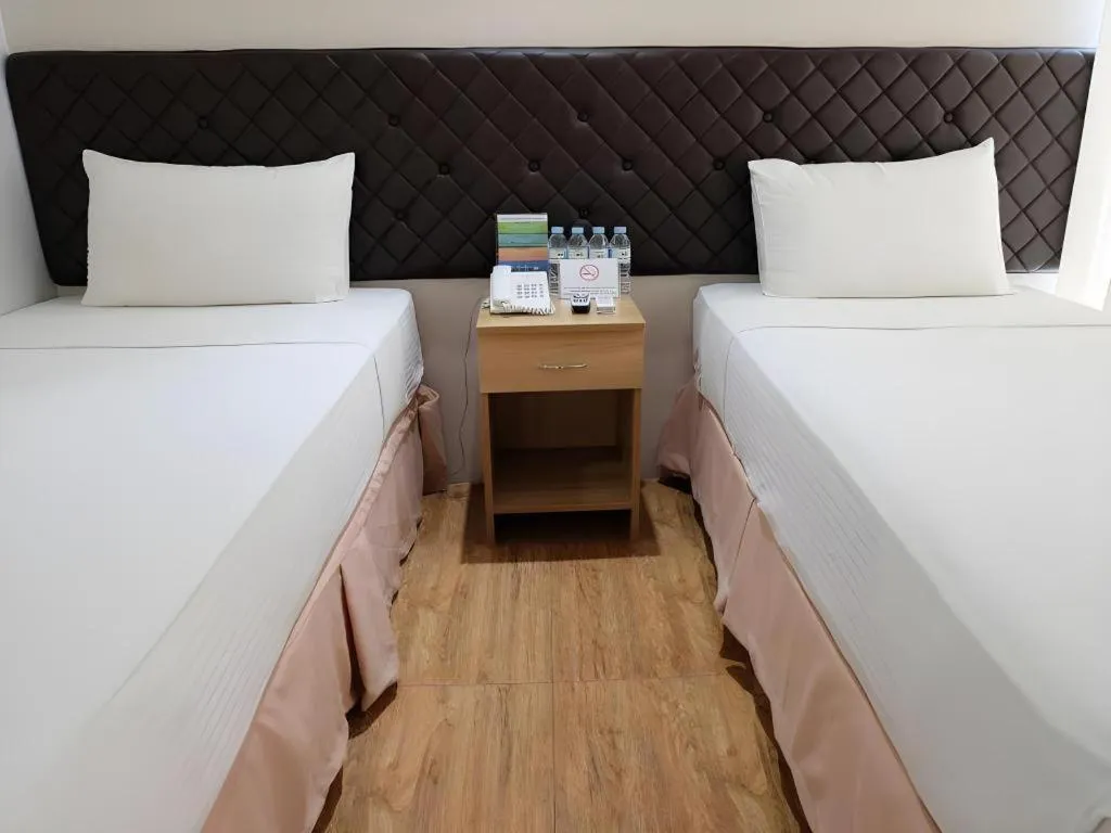 Bed in Capitol Central Hotel and Suites