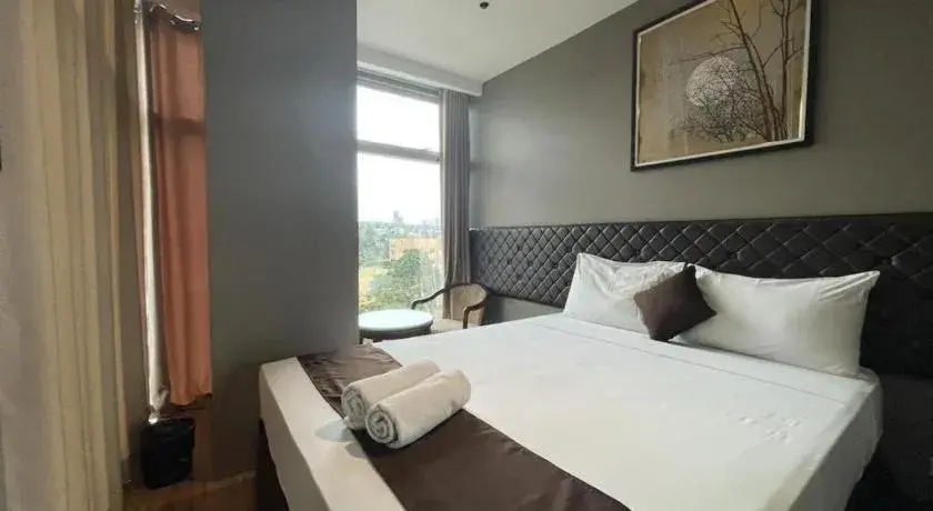 Bed in Capitol Central Hotel and Suites Bed in Capitol Central Hotel and Suites