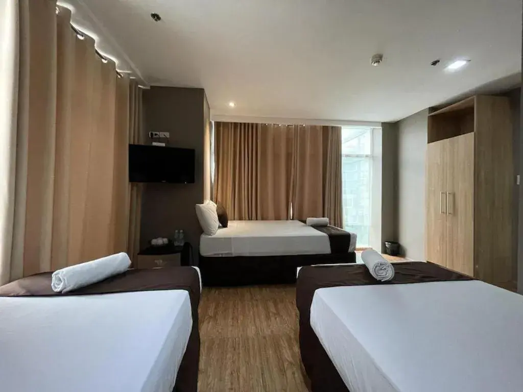 Bed in Capitol Central Hotel and Suites Bed in Capitol Central Hotel and Suites