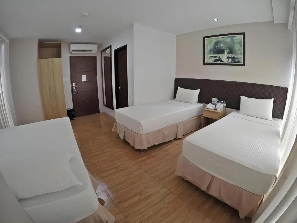 Bed in Capitol Central Hotel and Suites