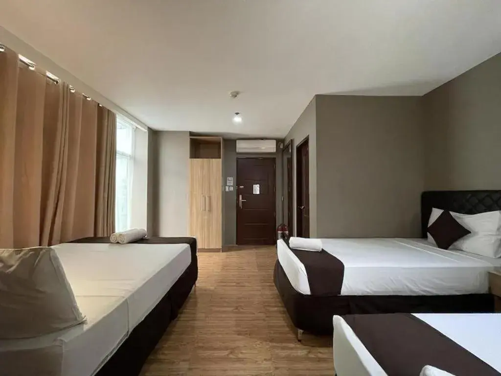 Bed in Capitol Central Hotel and Suites Bed in Capitol Central Hotel and Suites