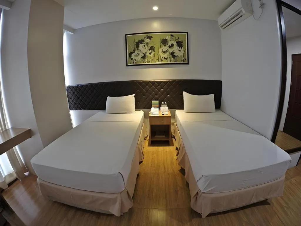 Bed in Capitol Central Hotel and Suites