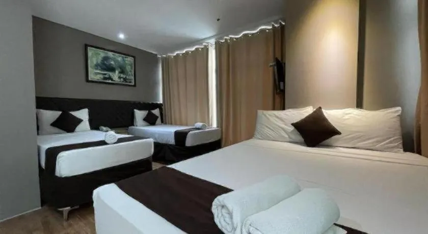Bed in Capitol Central Hotel and Suites