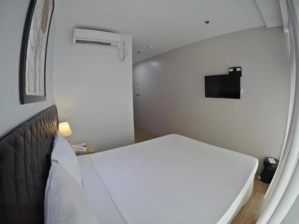 Bed in Capitol Central Hotel and Suites