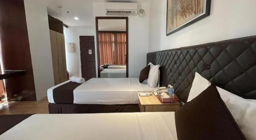 Bed in Capitol Central Hotel and Suites