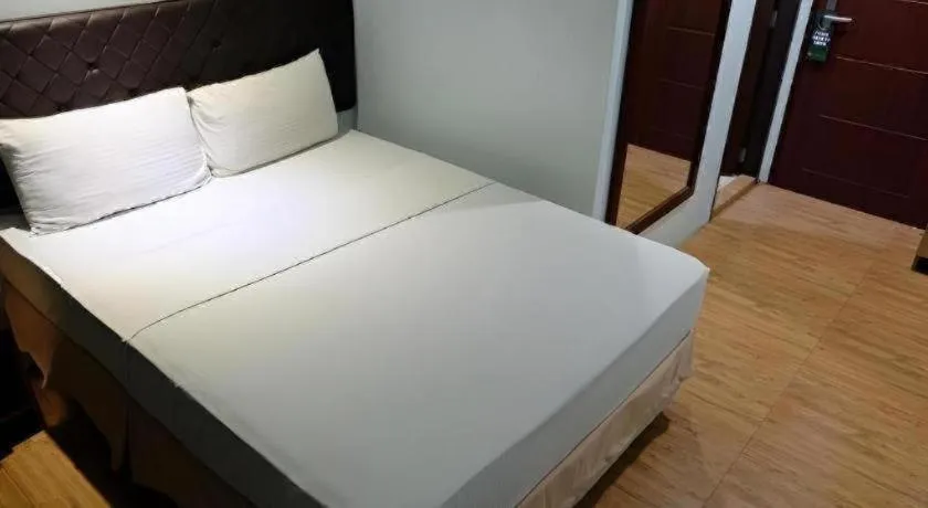 Bed in Capitol Central Hotel and Suites