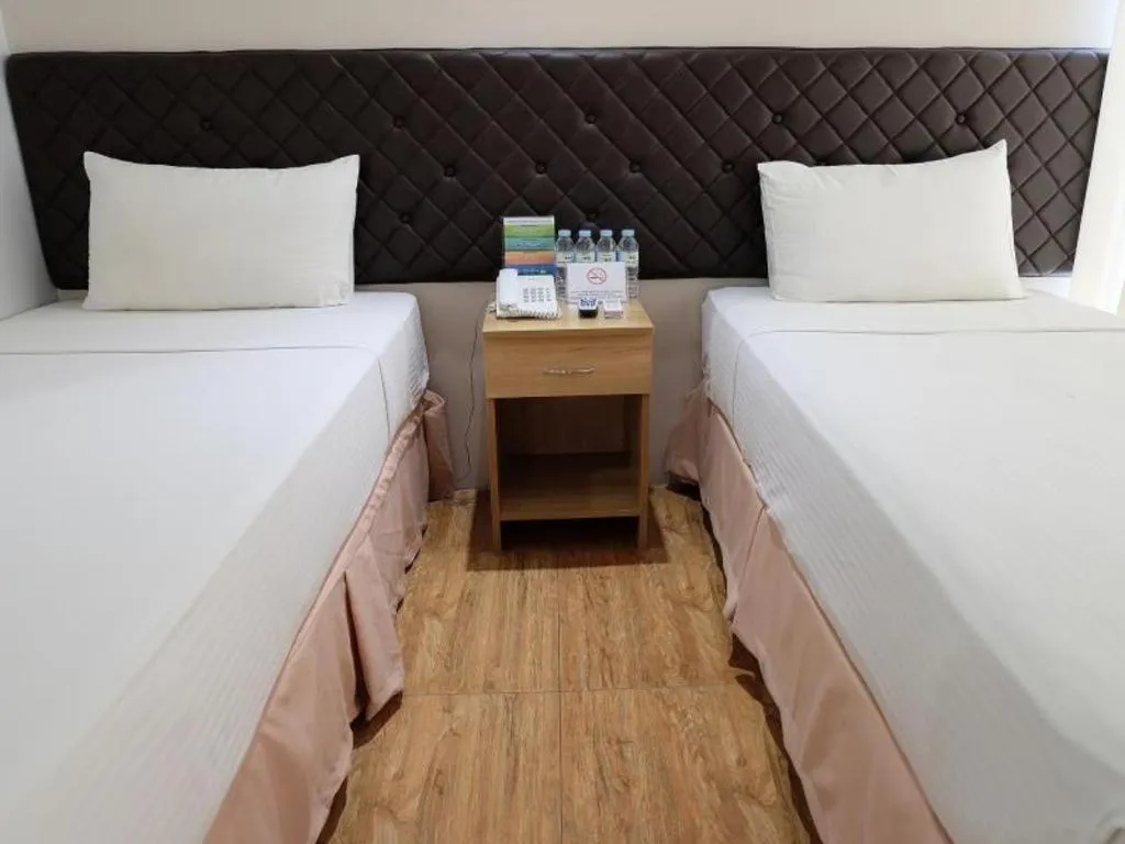 Bed in Capitol Central Hotel and Suites