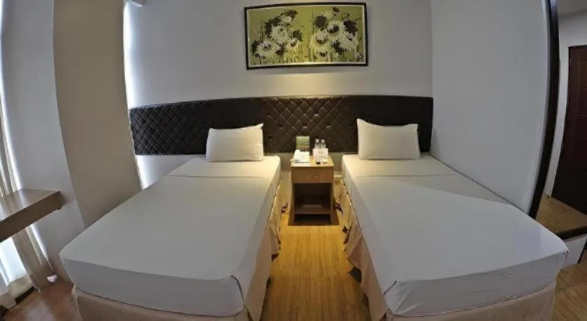 Bed in Capitol Central Hotel and Suites