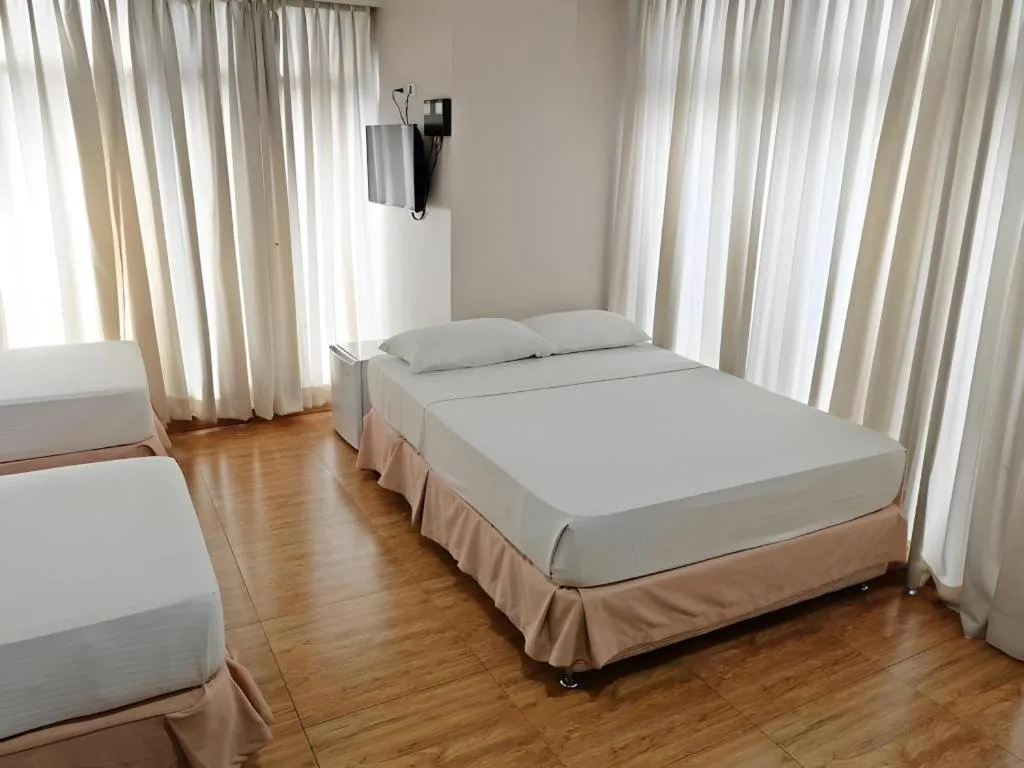 Bed in Capitol Central Hotel and Suites