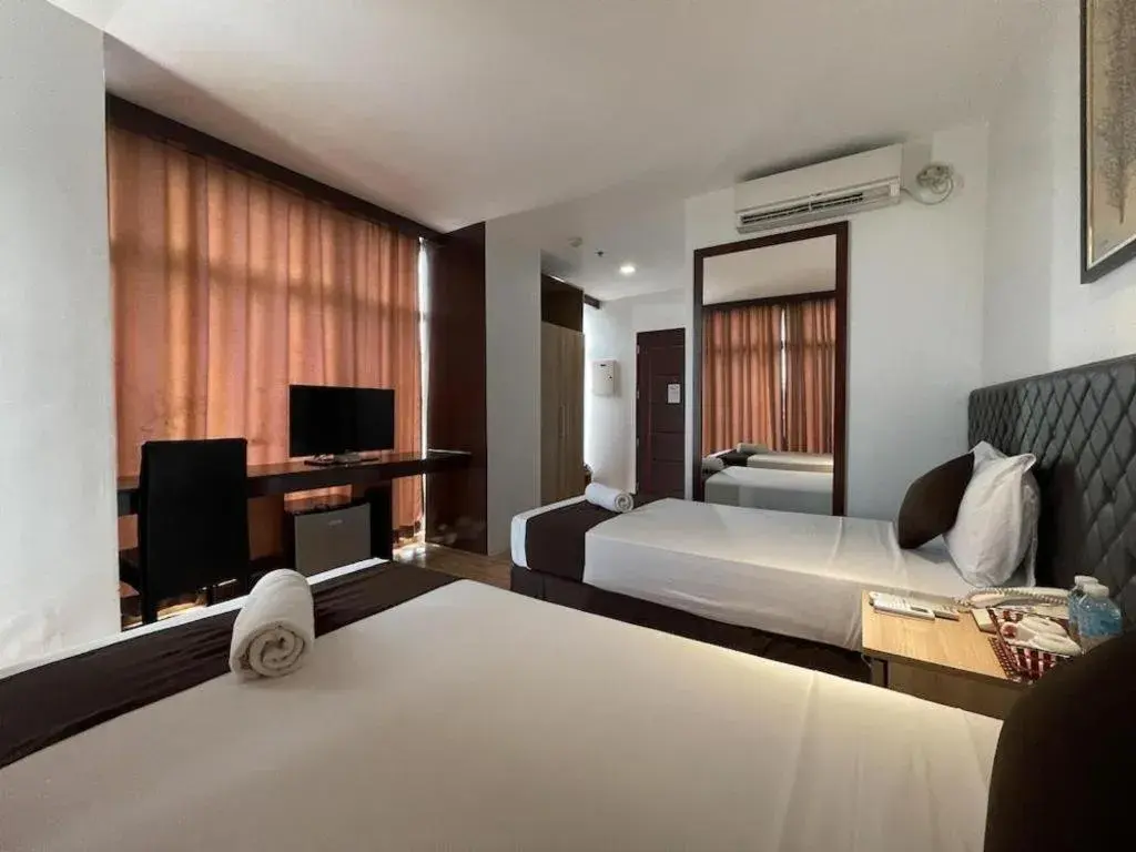 Bed in Capitol Central Hotel and Suites Bed in Capitol Central Hotel and Suites