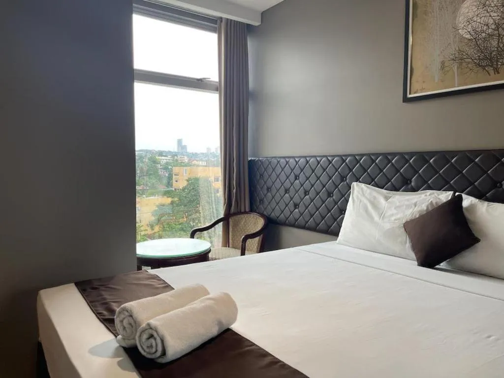 Bed in Capitol Central Hotel and Suites