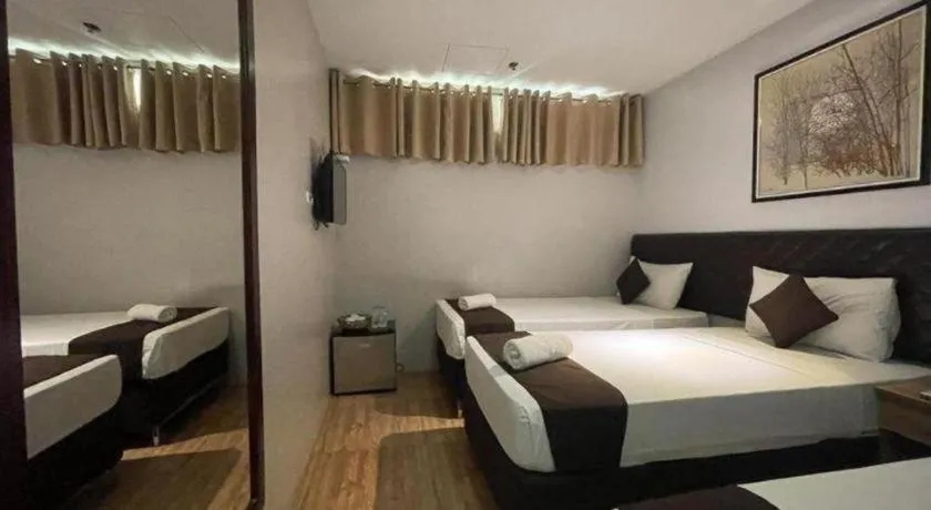 Bed in Capitol Central Hotel and Suites