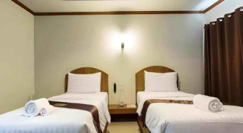 Bed in Thada Chateau Hotel