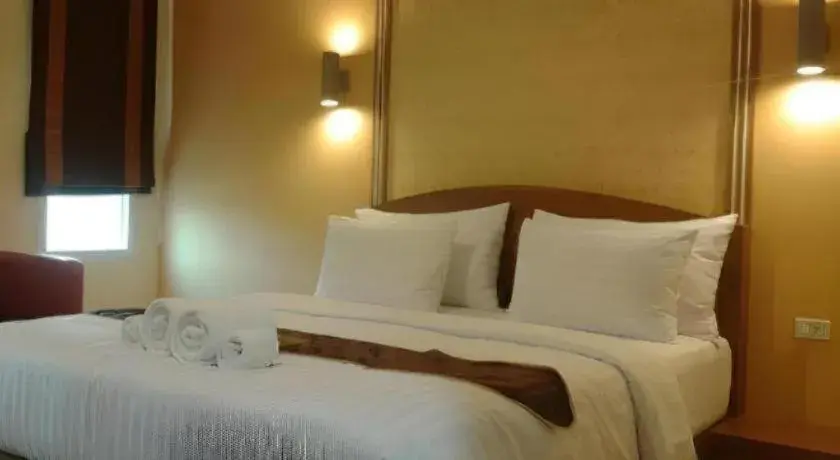 Bed in Thada Chateau Hotel Bed in Thada Chateau Hotel