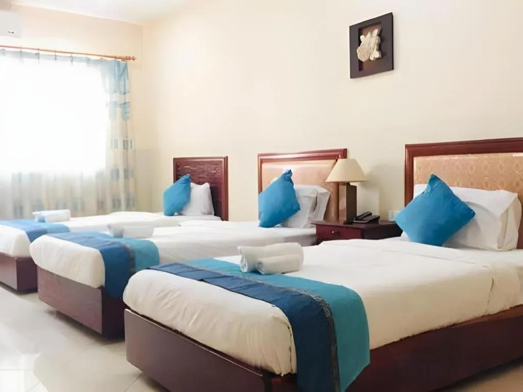 Bed in New Rose Boutique Hotel