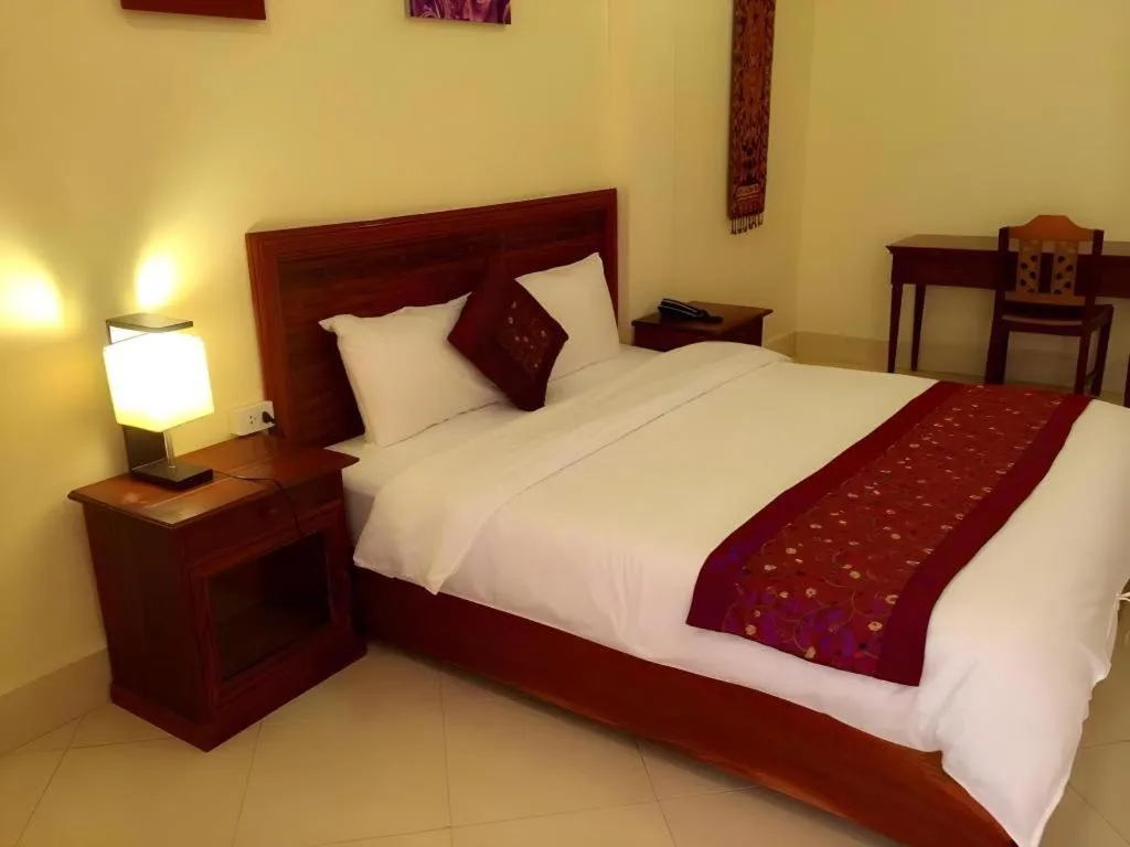 Bed in New Rose Boutique Hotel