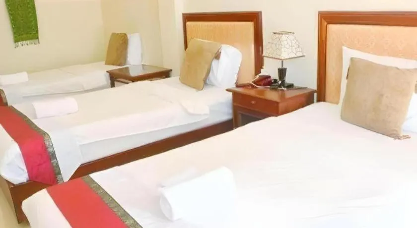 Bed in New Rose Boutique Hotel