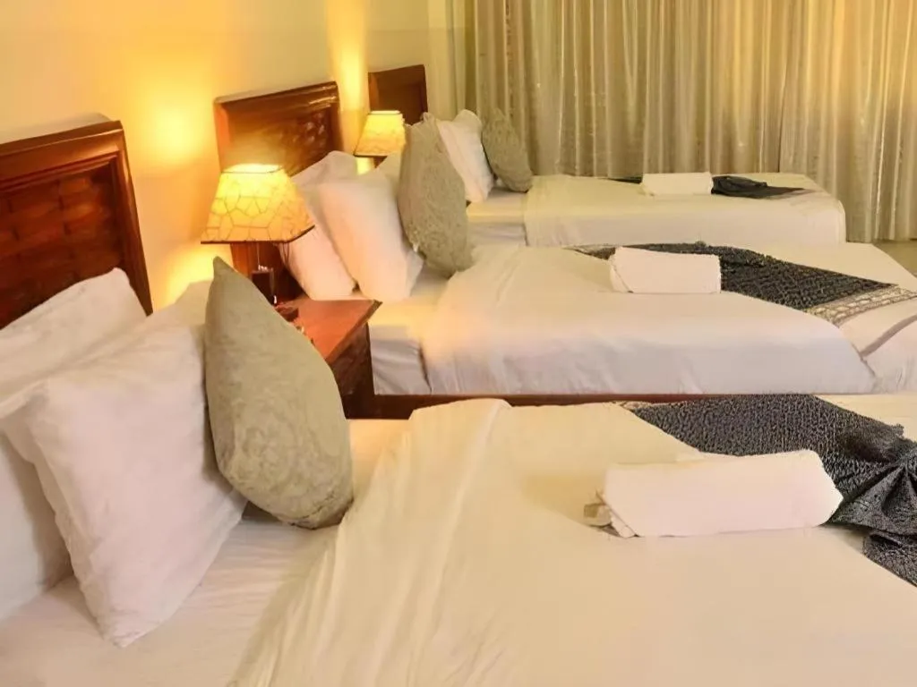 Bed in New Rose Boutique Hotel