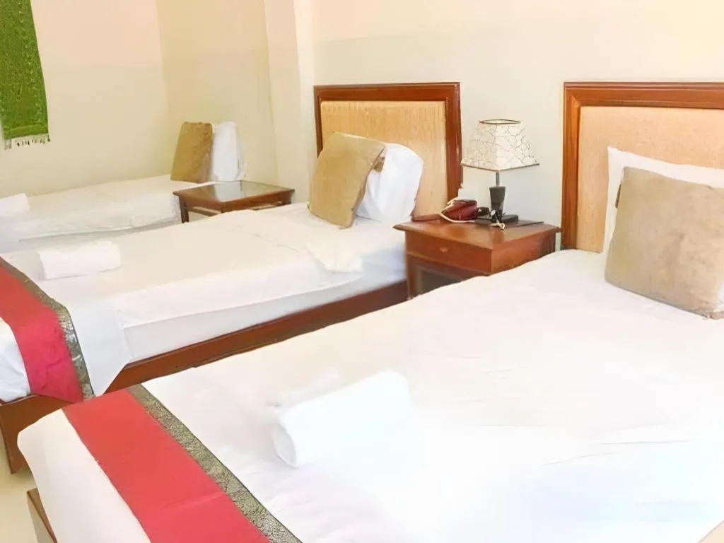 Bed in New Rose Boutique Hotel