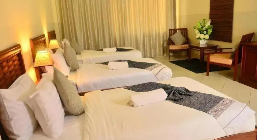 Bed in New Rose Boutique Hotel Bed in New Rose Boutique Hotel