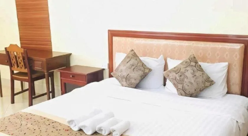 Bed in New Rose Boutique Hotel