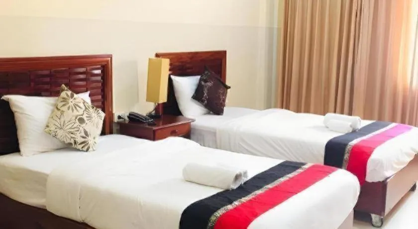 Bed in New Rose Boutique Hotel