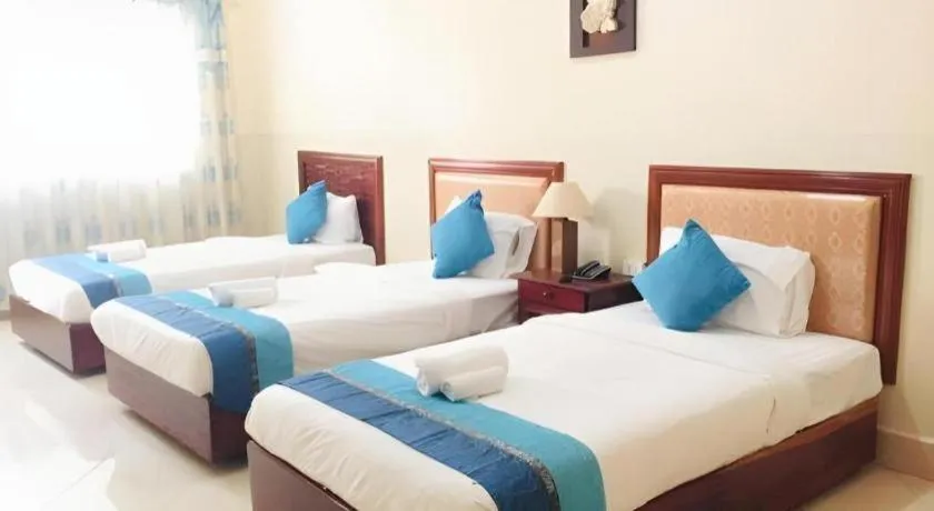 Bed in New Rose Boutique Hotel