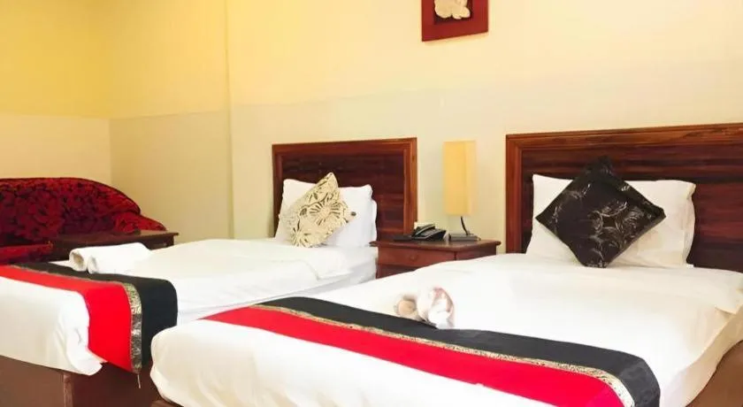 Bed in New Rose Boutique Hotel