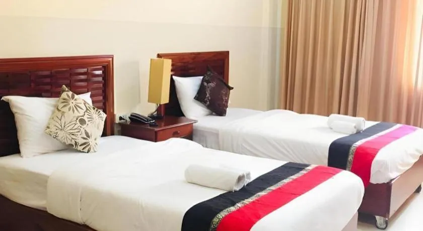 Bed in New Rose Boutique Hotel