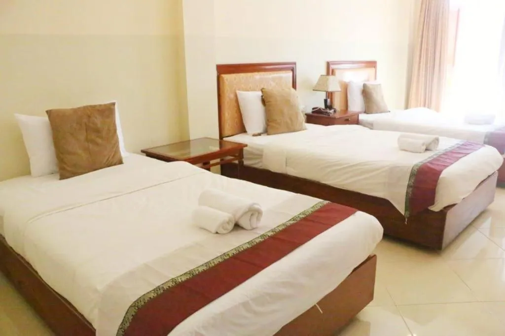 Bed in New Rose Boutique Hotel