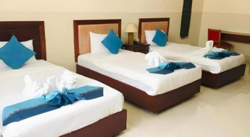 Bed in New Rose Boutique Hotel