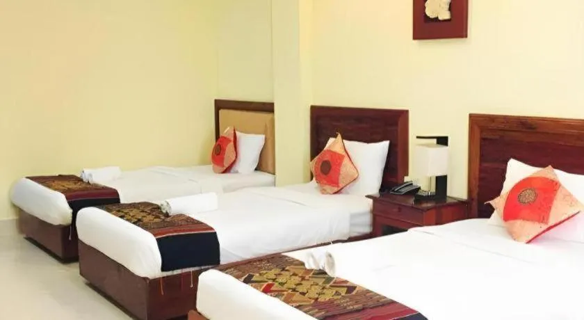 Bed in New Rose Boutique Hotel