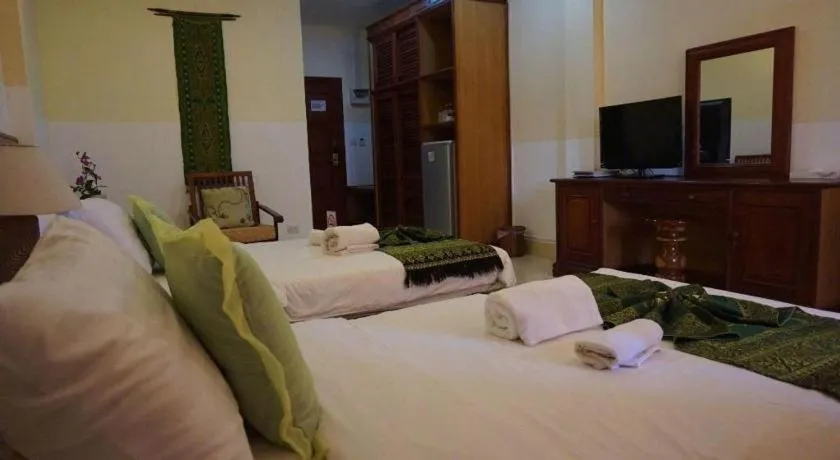 Bed in New Rose Boutique Hotel