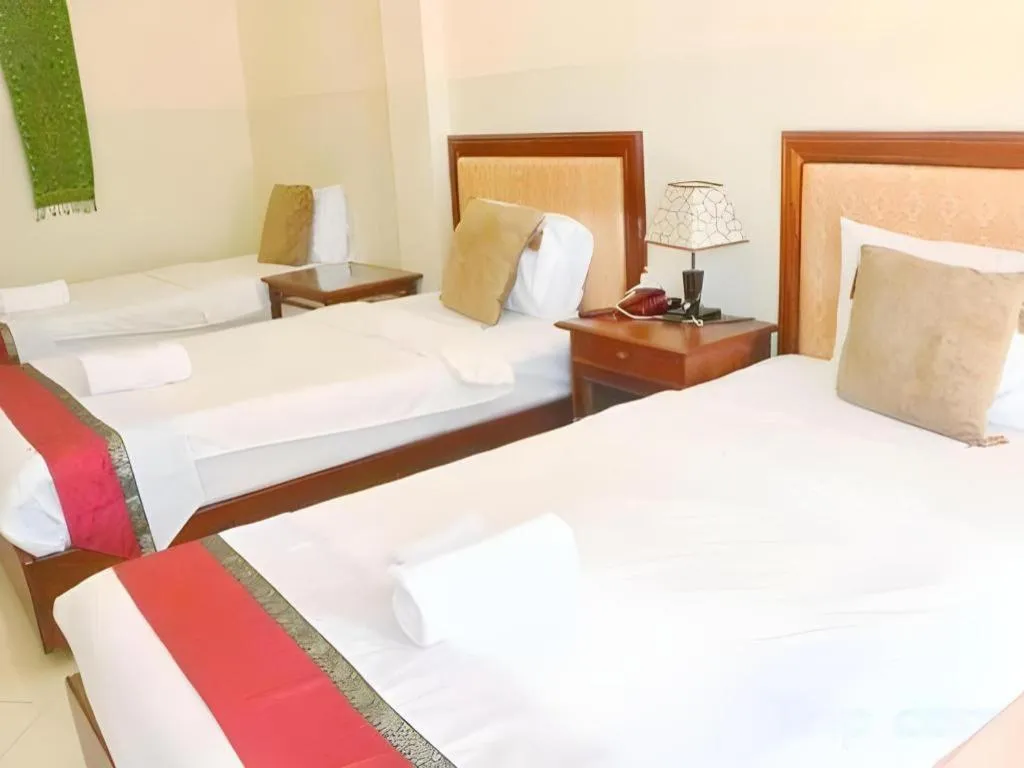 Bed in New Rose Boutique Hotel