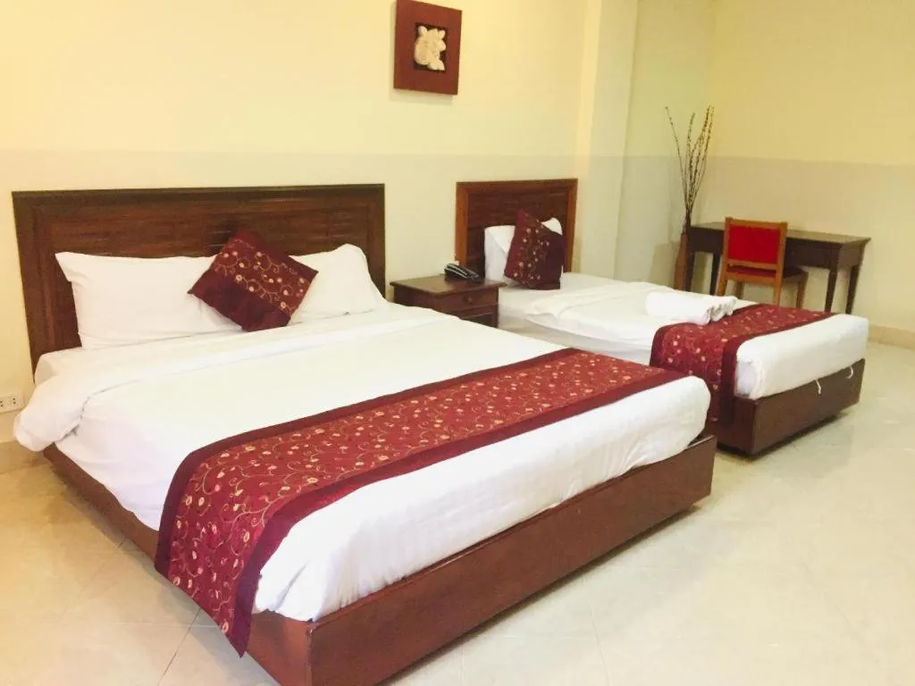 Bed in New Rose Boutique Hotel