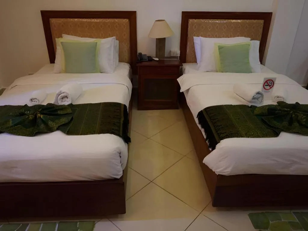 Bed in New Rose Boutique Hotel