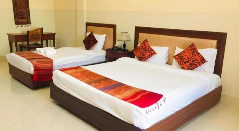 Bed in New Rose Boutique Hotel