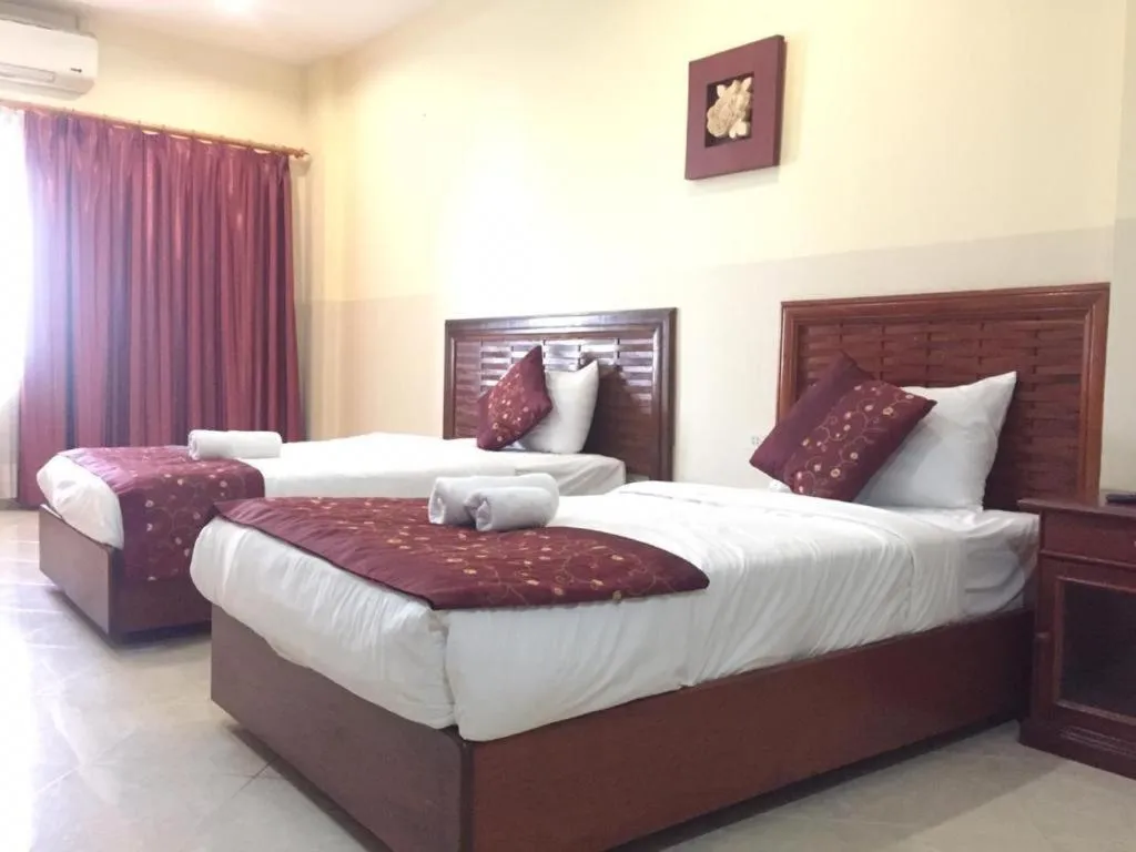 Bed in New Rose Boutique Hotel