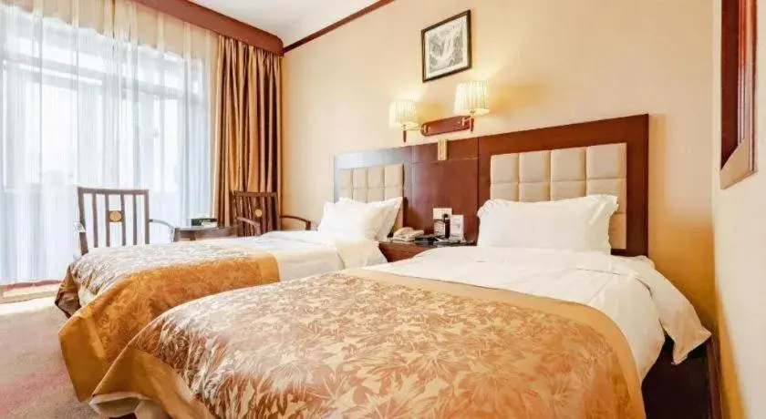 Bed in Lanzhou Hualian Hotel Bed in Lanzhou Hualian Hotel